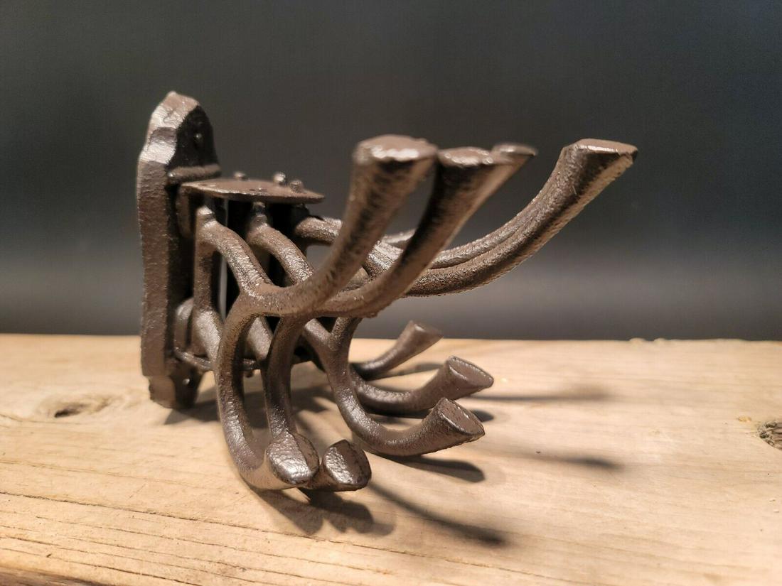 Wall Hook Swivel Folding Coat Hanger: (1) Hook 6" Tall.. 10 1/2" Wide 6 3/4" Extension Great reproduction sturdy iron wall hook cast from an antique. Notice the 5 folding arms Great textured black/brown/rust color powder coat... a very st