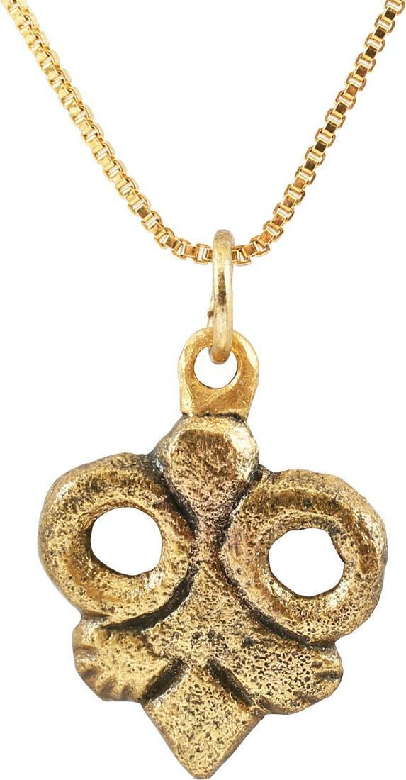 GOOD VIKING HEART PENDANT C.850-1050 AD: Just over 3/4" height. Heart form of addorsed circles forming the cusped top and a trefoil filling out the bottom. Foliate designs were favored by Vikings and incorporated into about half of the heart