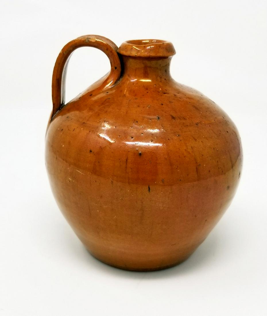 Early , small , redware jug in very good condition (1 of 3)