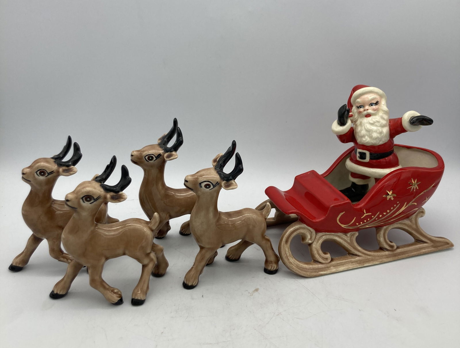 Rare Holland Mold Santa With Sleigh and 4 Reindeer Hand painted: Title: Rare Holland Mold Santa With Sleigh and 4 Reindeer Hand painted Date/Period: approx 1950-60's Dimension: Sleigh is 7" x 4" and 3.5" tall, Santa is 4.5" tall, Reindeer area 3.5" long and 4.5" ta