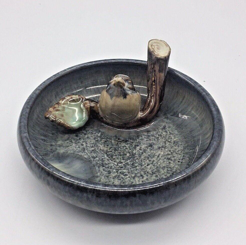 Art Pottery Trinket Dish Bowl Bluebird on a Branch ring holder: Title: Art Pottery Trinket Dish Bowl Bluebird on a Branch ring holder Date/Period: UNKNOWN Dimension: approx 4" diameter x 2" at tallest Materials: pottery Additional Information: Art Pottery Trinket