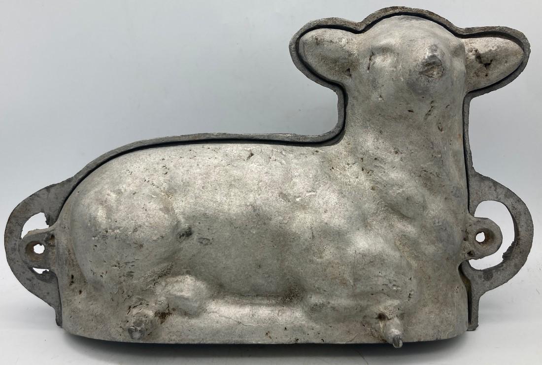 Cast Advertising Lamb/Sheep Cake Mold: Title: Cast Advertising Lamb/Sheep Cake Mold Date/Period: 1916 Dimension: approx. 13" x 8" x 4" Materials: cast aluminum Additional Information: Charming cast aluminium cake mold. Advertising piece fo