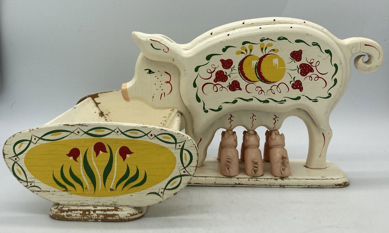 Folk Art Nursing Sow at Trough: Title: Folk Art Nursing Sow at Trough Date/Period: unknown Dimension: Approx 7" tall x 14" long x 10" wide Materials: Wood Additional Information: Colorful Folk Art. Mother pig nursing her six little 