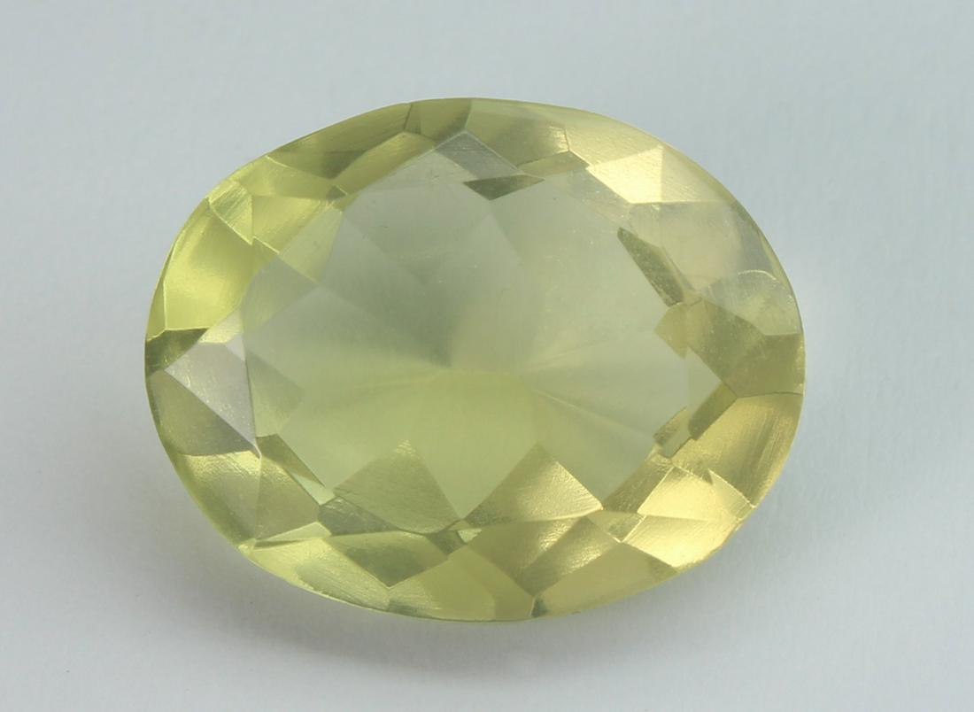 7.56 cts Natural Lemon Quartz: No Reserve! Title: 7.56 cts Natural Lemon Quartz Additional Information: Gemstone: Natural Lemon Quartz Origin: Africa Weight : 7.56 carats Measurements: 15x12 mm Shape / Cut : Oval Cut Colour: Yellow
