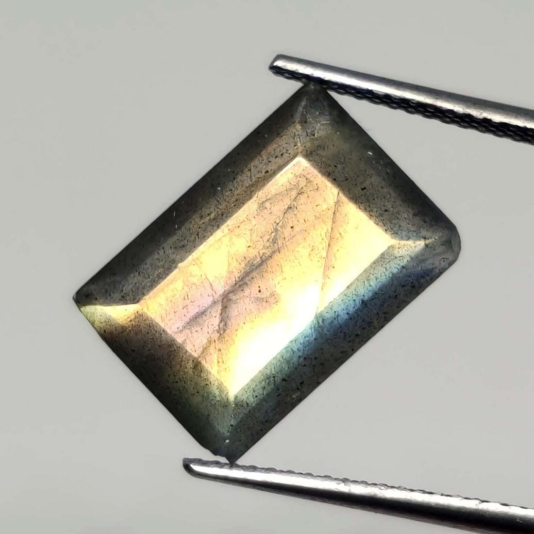 6.90 ct Natural Faceted Labradorite: No Reserve! Title: 6.90 ct Natural Faceted Labradorite Additional Information: Gemstones: Labradorite Carat Weights: 6.90 ct Size/Dimensions: 14 X 10 X 5 mm Origin : Labrador Materials & Techniques: L