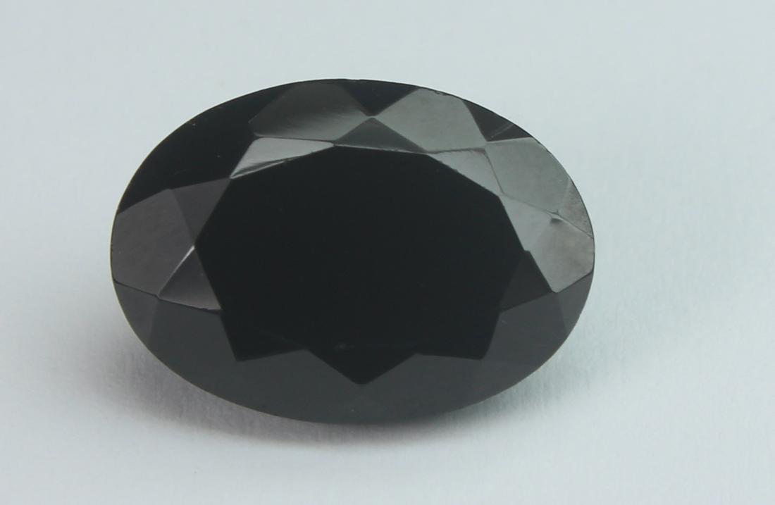 7.51 Cts Natural Black Spinel: No Reserve! Title: 7.51 Cts Natural Black Spinel Additional Information: Gemstone : Natural Black Spinel Shape and cut : Oval Cut Origin : Africa Weight : 7.51 carats Measurements : 14x10 mm , Color :