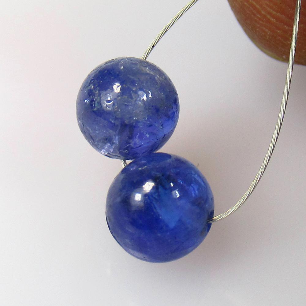 4.40 Ctw Natural 2 Drilled Tanzanite Round Ball Beads: No Reserve! Title: 4.40 Ctw Natural 2 Drilled Tanzanite Round Ball Beads Stone Clarity: Transparent Gemstones: Natural Tanzanite Beads Carat Weights: 4.4 Size/Dimensions: 6.30 - 6.50 mm / 2 PC's Addit