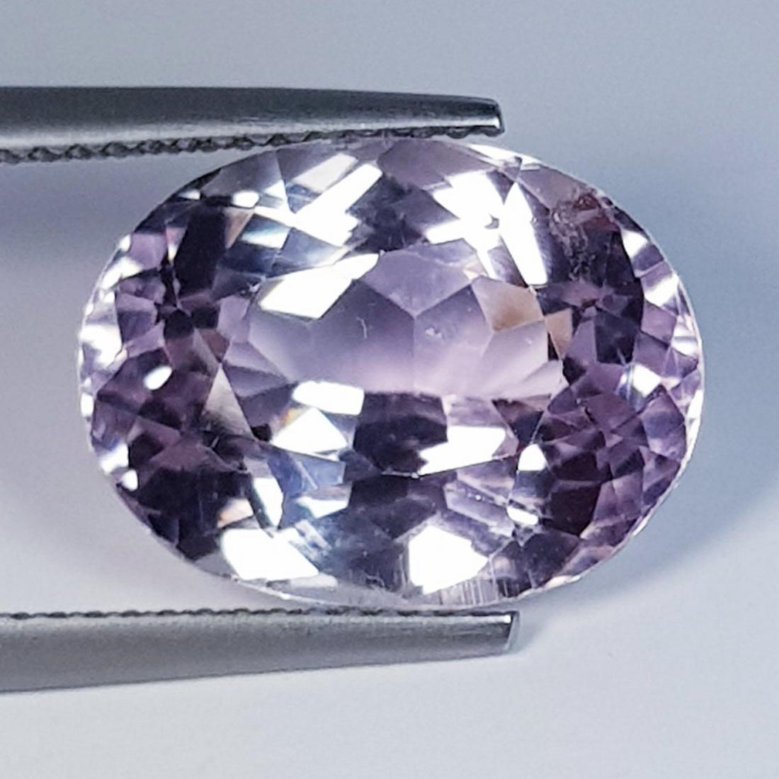 10.14 ctz " Lovely Pink Gem" Oval Cut Natural Kunzite: No Reserve! Title: 10.14 ctz " Lovely Pink Gem" Oval Cut Natural Kunzite Color/Clarity: Pink / IF Gemstones: Kunzite Carat Weights: 10.14 Size/Dimensions: 14.90 x 11.30 x 8.40 Additional Information: 