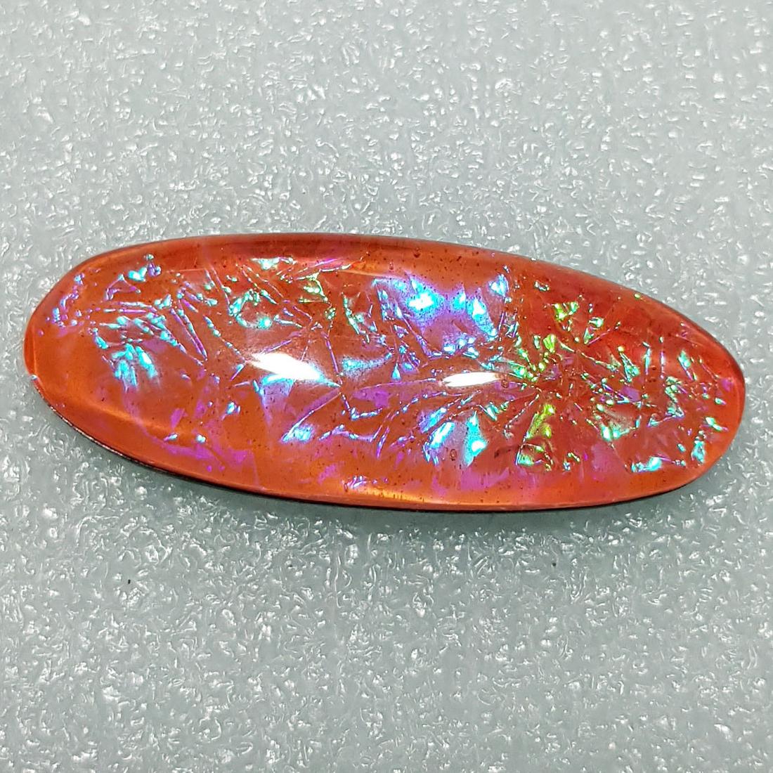 24.13 ctz Australian Doublet Opal: No Reserve! Title: 24.13 ctz Australian Doublet Opal Color/Clarity: Orange / Transparent Gemstones: Opal Doublet Carat Weights: 24.13 Size/Dimensions: 34.95 x 13.20 x6.60 Additional Information: Oval 