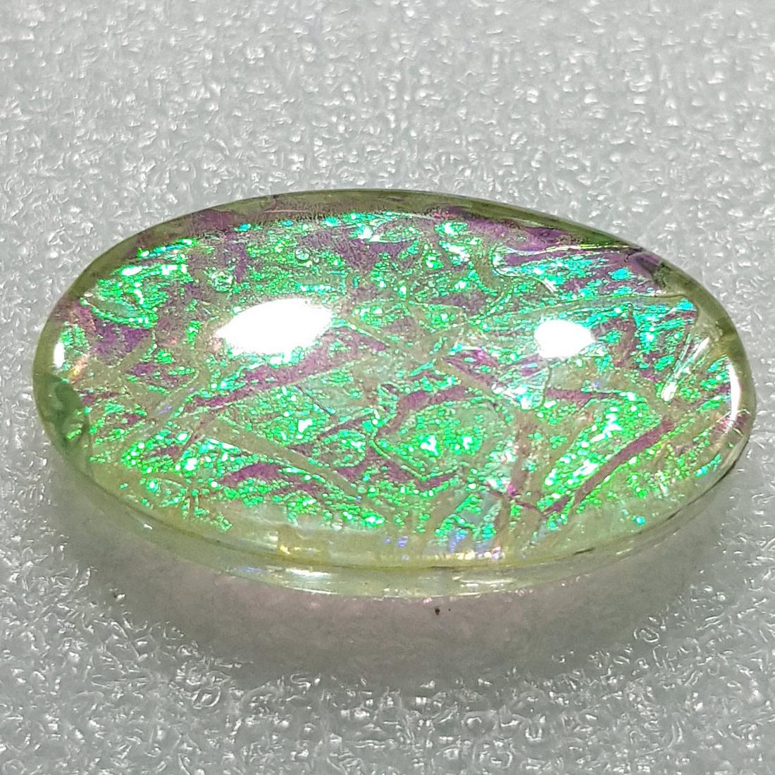 26.87 ctz Australian Doublet Opal: No Reserve! Title: 26.87 ctz Australian Doublet Opal Color/Clarity: Green / Trasparent Gemstones: Opal Doublet Carat Weights: 26.87 Size/Dimensions: 28.60 x 16.40 x 6.60 Additional Information: Oval /