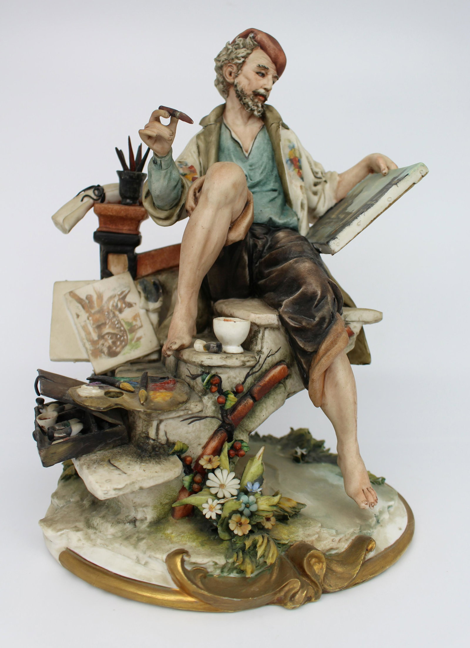 Capodimonte Painter by Cappelli: Capodimonte Painter by Cappelli Capodimonte, made in Italy. Mid/late 20th century. Signature of the artist to the back disguised in the brickwork Measures 20 x 18 x 27 (height) cm. Good condit