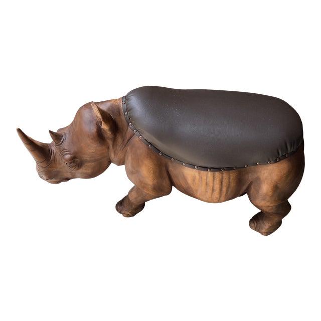 1990s Vintage Wooden Rhino Brown Stool With Cushion: Absolutely beautiful hand carved wooden rhino with brown seat. Heavy. White glove delivery available DIMENSIONS 14ʺW × 40ʺD × 21ʺH STYLES AfricanChildren's NUMBER OF SEATS 1 S