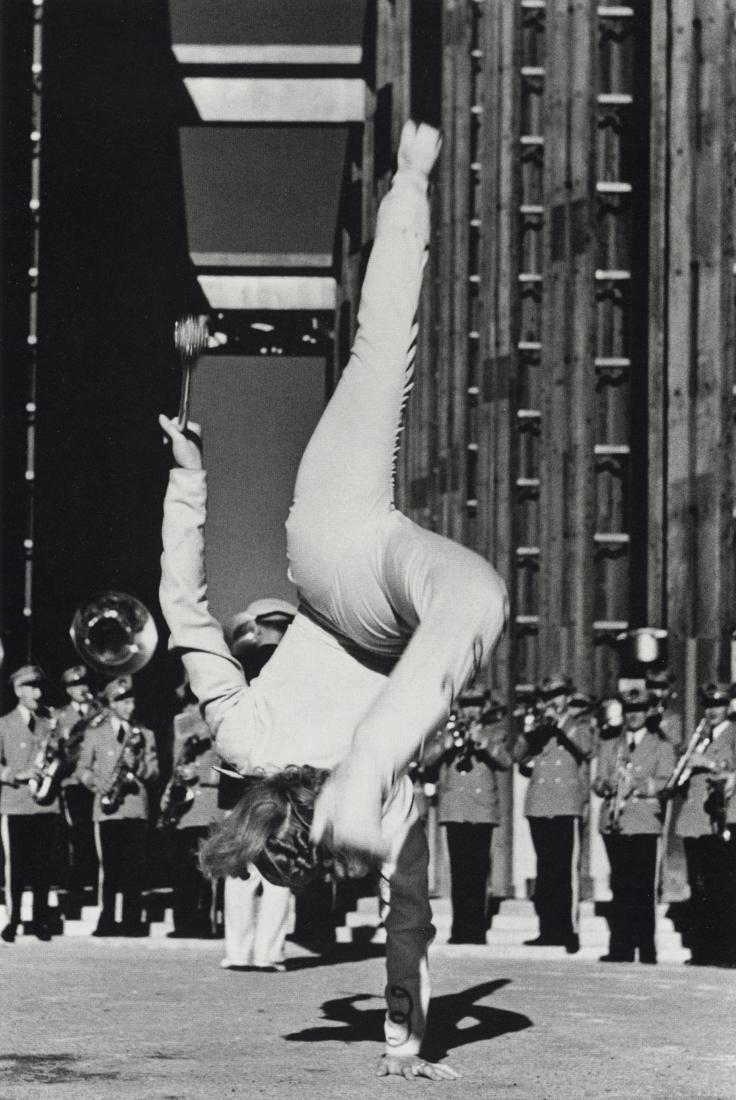 JOHN GUTMANN - Majorette, 1939: Artist: John Gutmann Title: Majorette, 1939 Medium: Photo Litho, 2000, Spain Dimensions: 5.85x8.7" Description: Heat Wax Mounted on 8.5x11" Conservation Board Artist Bio: John Gutmann (1905-1998) was