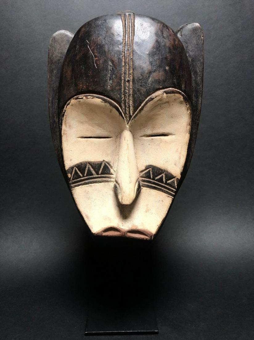 Ngil Gorilla Mask - Wood - Fang - Gabon: These masks were used by the male NGIL society that no longer exists today. This secret society was responsible for the initiation and they fought against witchcraft. The Ngil had a ritual purifying f