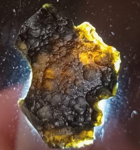 PHILIPPINITE TEKTITE - FROM METEORITE IMPACT: Title: PHILIPPINITE TEKTITE - FROM METEORITE IMPACT Origin: Anda, Cabarruyan Isl. Pangasinan, Luzon, Philippines Size: 1.8x1.3x0.6 cm / 1.39 gram Description: flat, translucent philippinite tektite wi