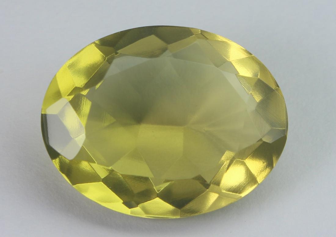 13.77 cts Natural Lemon Quartz: No Reserve! Title: 13.77 cts Natural Lemon Quartz Additional Information: Gemstone: Natural Lemon Quartz Origin: Africa Weight : 13.77 carats Measurements: 18.87x14.75x8.06 mm Shape / Cut : Oval Cut C