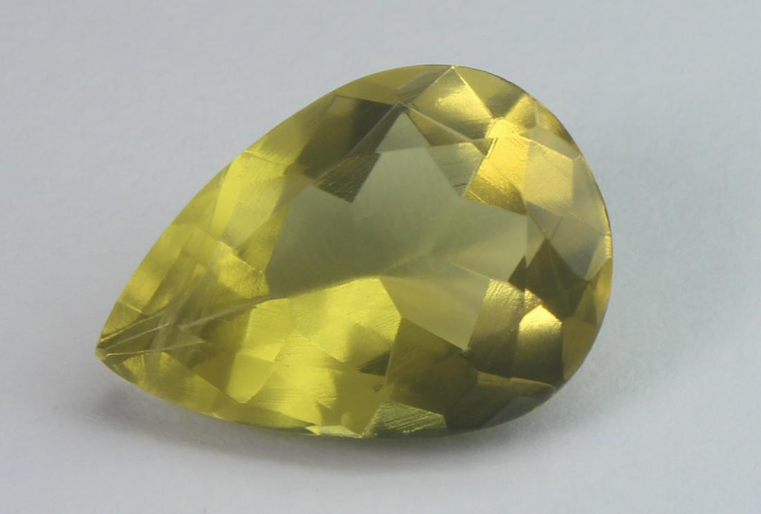 10.24 cts Natural Lemon Quartz: No Reserve! Title: 10.24 cts Natural Lemon Quartz Additional Information: Gemstone: Natural Lemon Quartz Origin: Africa Weight : 10.24 carats Measurements : 12.75x13.15x7.98 mm Shape / Cut : Pear Cut 
