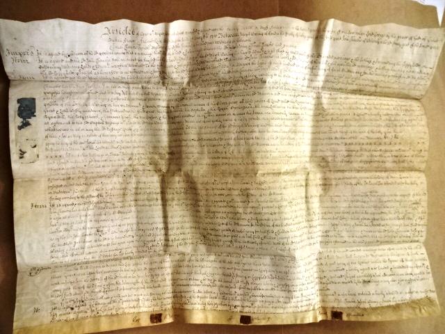 1715 English Vellum Articles of Agreement Red Wax Seals: Large English vellum being Articles of Agreement between parties including John Waring of the manor of Ford in Salop for a Capital Messuage in Ford including its grounds. Dated the second year of Geor