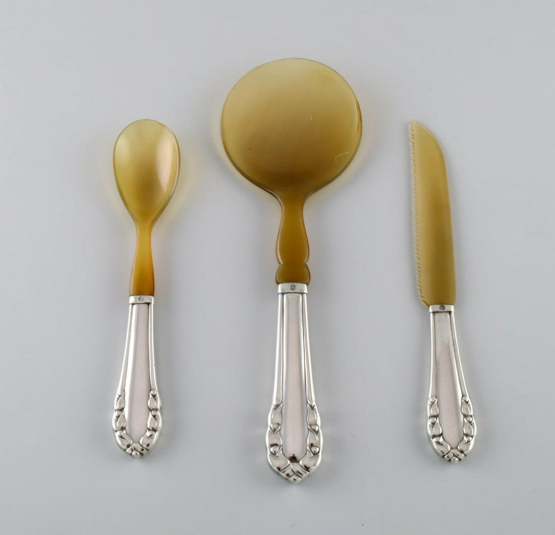 Three early parts Georg Jensen Lily of the valley in silver (830) and horn. Dated 1915-1930.: Title: Three early parts Georg Jensen Lily of the valley in silver (830) and horn. Dated 1915-1930. Description: Three early parts Georg Jensen Lily of the valley in silver (830) and horn. Dated 1915-