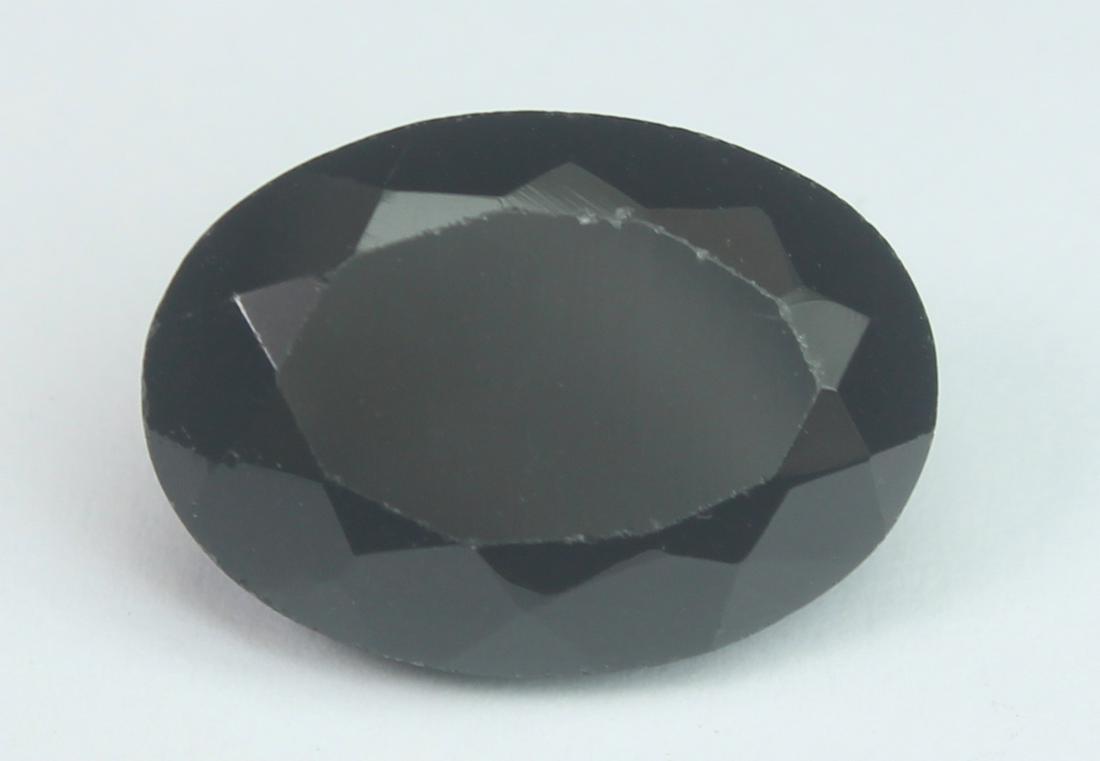 7.65 Cts Natural Black Spinel: No Reserve! Title: 7.65 Cts Natural Black Spinel Additional Information: Gemstone : Natural Black Spinel Shape and cut : Oval Cut Origin : Africa Weight : 7.65 carats Measurements : 14x10 mm , Color :