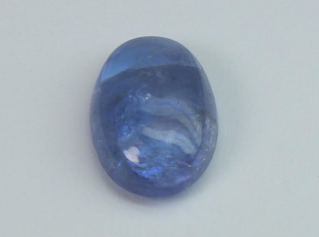 2.42 Cts Natural Tanzanite Lot: No Reserve! Title: 2.42 Cts Natural Tanzanite Lot Additional Information: Gemstone : Natural Tanzanite Origin: Tanzania Weight : 2.42 carats Dimensions : 10x7 mm Shape/Cut: Oval Cabochon Color : Viole