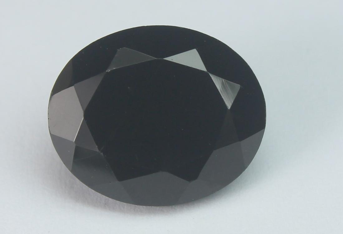6.22 Cts Natural Black Spinel: No Reserve! Title: 6.22 Cts Natural Black Spinel Additional Information: Gemstone : Natural Black Spinel Shape and cut : Oval Cut Origin : Africa Weight : 6.22 carats Measurements : 12x10 mm , Color :