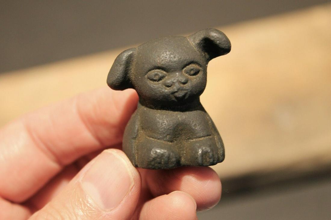 Miniature Cast Iron "Griswold Pup" Dog: 1 1/2" Tall x 1" wide Great little reproduction cast iron "Griswold pup" dog. All cast iron slightly distressed as shown in the images. Certainly looks old! See our other miniature cast iron animals! 