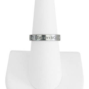 Tiffany & Co. Platinum and Diamond 4mm Band Ring Size 5.75: Details Condition: Excellent Condition, Professionally Cleaned and Polished Metal: Platinum 950 (Marked, and Professionally Tested) Weight: 7.5g Diamonds: Three Round Brilliant Diamonds 0.06cttw 