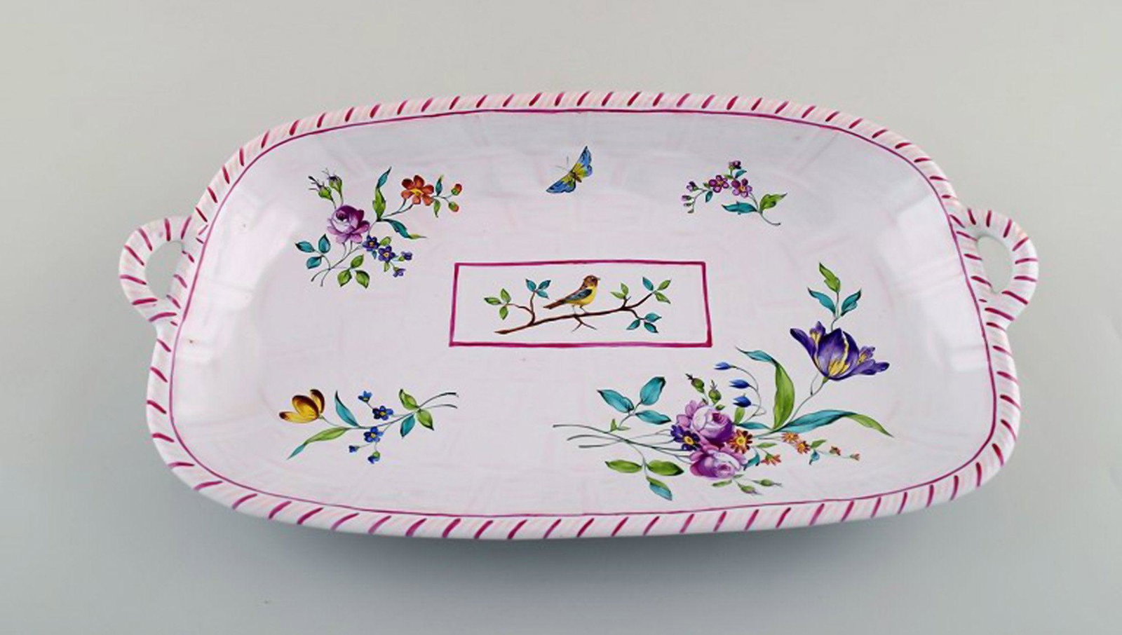 Emile Gallé for St. Clement, Nancy. Dish on four feet in hand-painted faience. Decorated with: Title: Emile Gallé for St. Clement, Nancy. Dish on four feet in hand-painted faience. Decorated with flowers and birds. 1870's. Description: Emile Gallé for St. Clement, Nancy. Dish on four