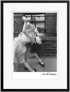 Dancing in the Street (Framed): Two young girls dancing together in the street. TITLE: Dancing in the Street PHOTO: Thurston Hopkins SIGNED LIMITED EDITION PAPER: SILVER GELATIN FIBRE PRINT FULLY FRAMED: 17 x 21 INCH PICTURE SIZE: 1