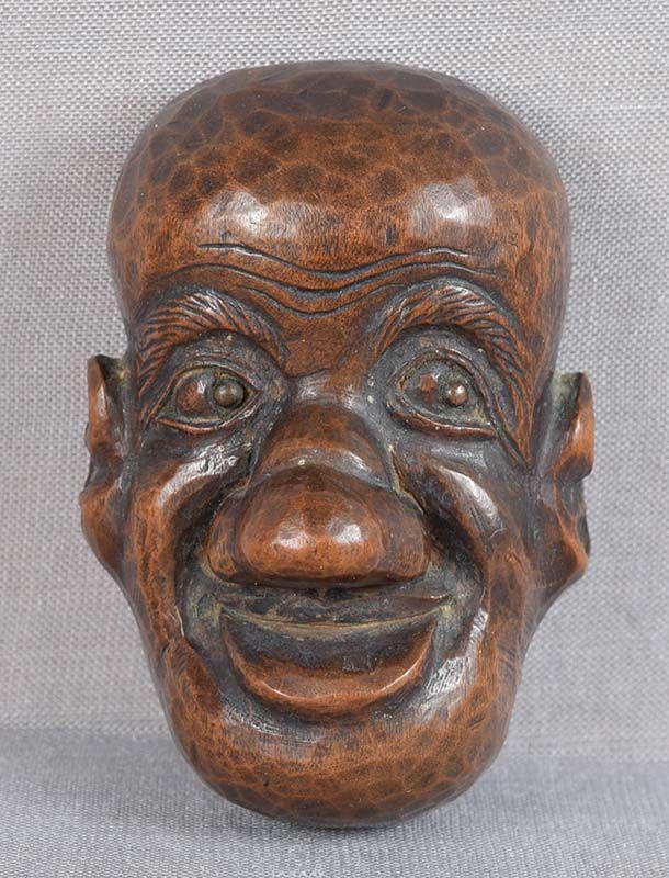 19c netsuke MASK long nosed peasant, fine ittobori technique: 19th century boxwood mask netsuke of a long nosed peasant with very unusual feature - all surfaces including the back are carved in subtle version of ittobori (one cut) technique reminiscent of hammer