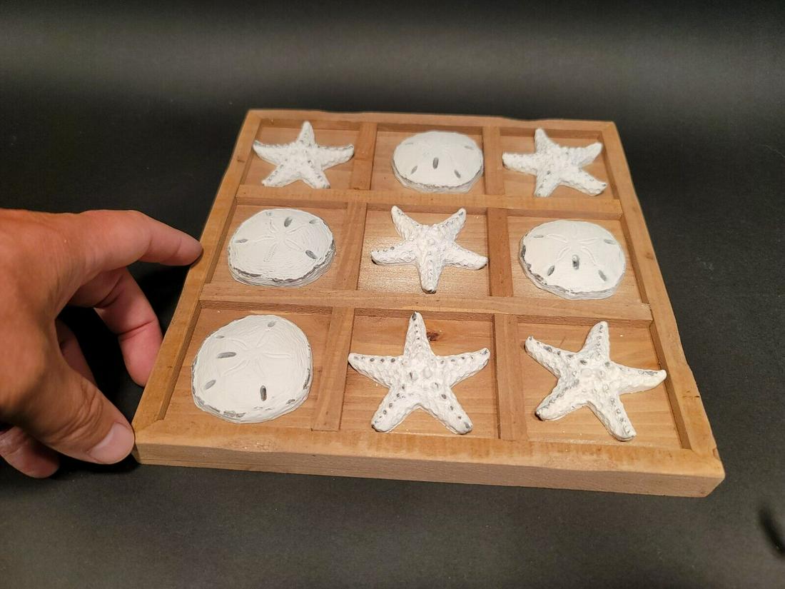 Coastal Starfish Sand Dollar Tic Tac Toe Coffee Table Game: 9" x 9" 9"x9"x1" Wonderful wood board with resin starfish and sand dollars. Reserve: $30.00 Shipping: Domestic: Flat-rate of $11.00 to anywhere within the contiguous U.S. International: Foreign shippi