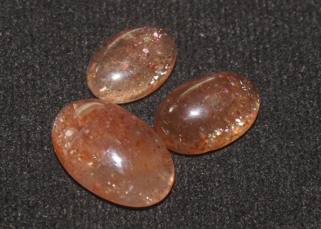 10.88 Cts Natural Sunstone Lot: No Reserve! Gemstone: Natural Sunstone Origin: Africa Weight: 10.88Carats Dimensions: 14.87x9.88x4.48 mm , 12.41x8.25x5.02 mm, 11.10x7.65x3.45 mm Shape: Oval Cabochon Number Of Stone: 3 Color: Orange