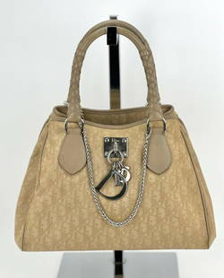 Christian Dior Tote Diorissimo Canvas Small Beige Tote Added Chain B500: SKU B500 0522 Pre-Owned 100% Authentic Christian Dior Diorissimo Small Beige Canvas Tote W/ added Non Dior Chain RATING: B-... Good,shows minor signs of wear MATERIAL: Dior canvas, leather trim