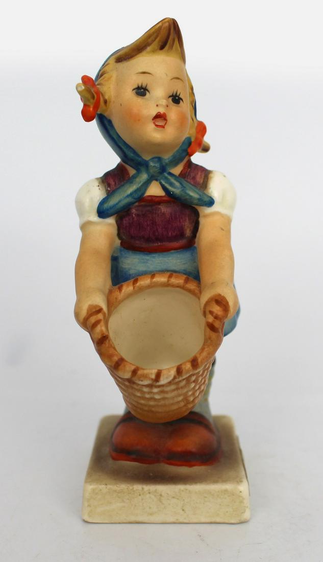 Hummel Little Helper Figurine: Hummel Little Helper Figurine. Measures 4 x 6 x 10.5 (height) cm. Very good condition; no chips, cracks or repairs Reserve: $18.00 Shipping: Domestic: Flat-rate of $54.00 to anywhere within the contig