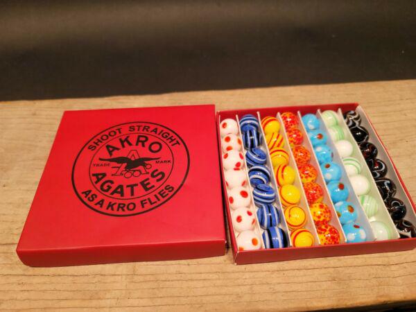 Akro Agates Marble set w Box: 5/8" Marbles as shown. Wonderful reproduction set of marbles . Great Set! All our items come with a 100% customer satisfaction guarantee. ... Reserve: $30.00 Shipping: Domestic: Flat-rate of $6.00 to