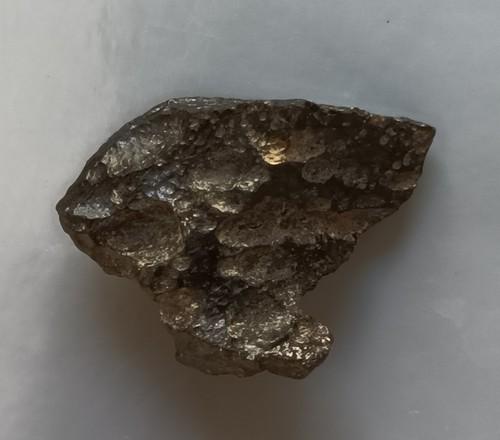 PHILIPPINITE TEKTITE - FROM METEORITE IMPACT: Title: PHILIPPINITE TEKTITE - FROM METEORITE IMPACT Origin: Anda, Cabarruyan Isl. Pangasinan, Luzon, Philippines Size: 2.1x1.5x0.9 cm / 2.18 gram Description: small triangulat philippinite tektite. mi