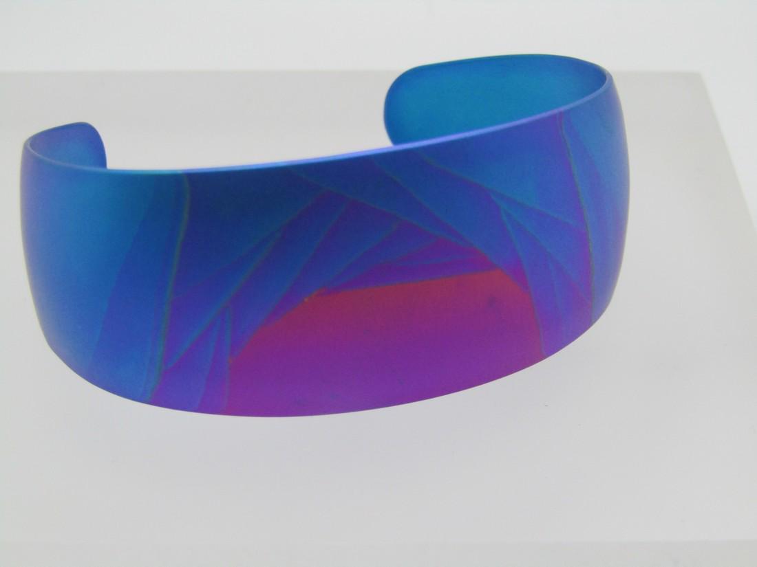 Kenneth Reid Titanium Cuff Bracelet, Purple, Pin, Teal, Magents: Kenneth Reid Titanium Cuff Bracelet, Purple, Pin, Teal, Magenta. This has an inside measurement of 6.25 with a 1.25" opening ion the back. Easy to slip on. I have a 7.25" wrist and it was easy to get