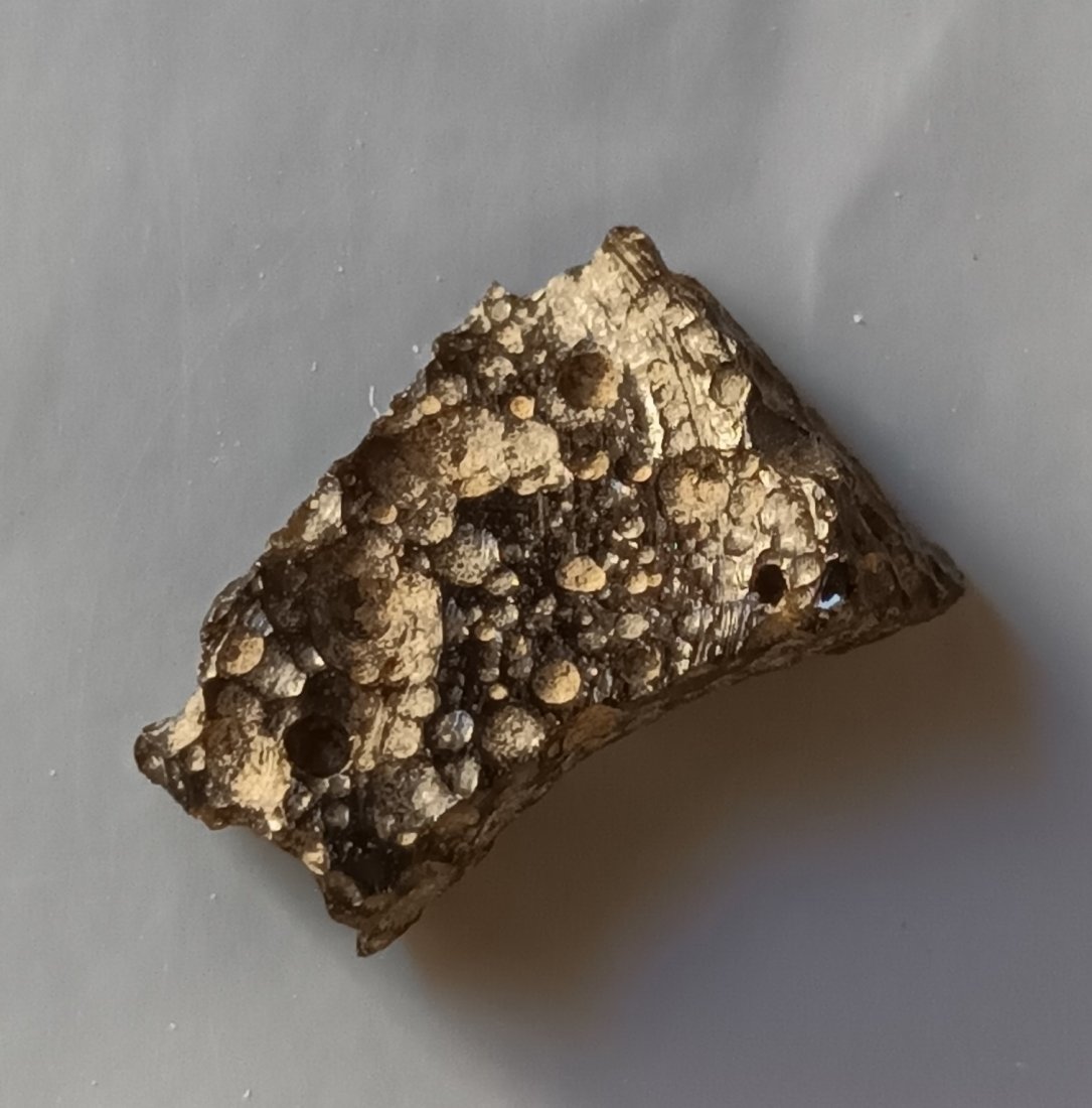 PHILIPPINITE TEKTITE - FROM METEORITE IMPACT: Title: PHILIPPINITE TEKTITE - FROM METEORITE IMPACT Origin: Anda, Cabarruyan Isl. Pangasinan, Luzon, Philippines Size: 1.8x1.1x0.5 cm / 1.14 gram Description: flat pitted, translucent philippinite tek