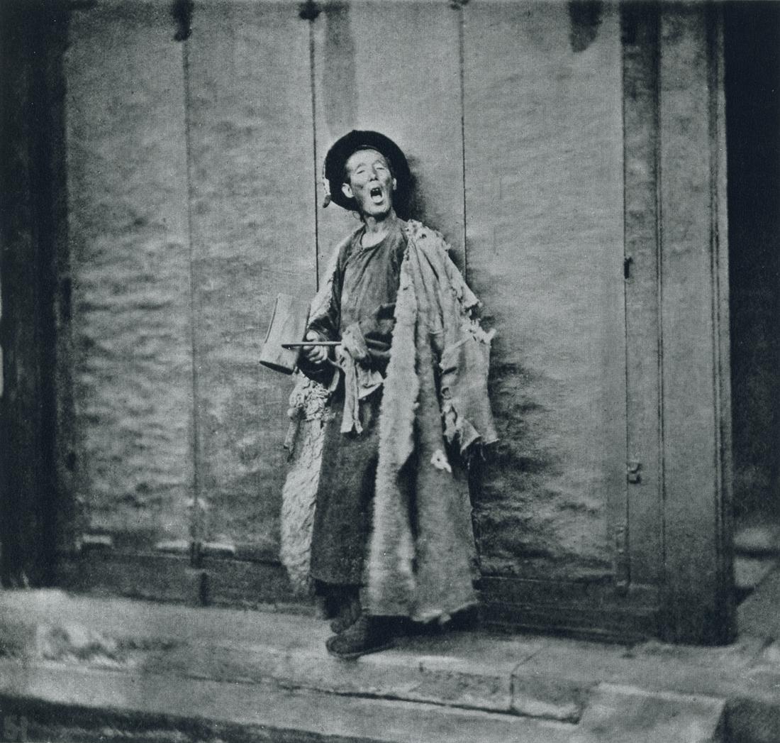 JOHN THOMSON - Night Watchman, Peking, 1865: Artist: John Thomson Title: Night Watchman, Peking, 1865 Medium: Photo Litho, 1972, USA Dimensions: 6.7x6.4" Description: Heat Wax Mounted on 8.5x11" Conservation Board Artist Bio: John Thomson (1837