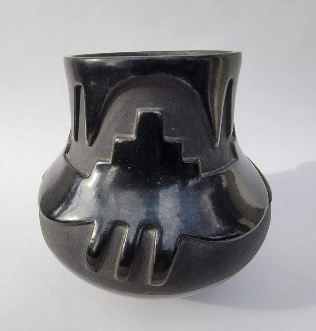 Large San Ildefonso Avanyu pot: Title: Large San Ildefonso Avanyu pot Dimension: 8 1/2" high x 8 1/2" diameter Description: Juanita Montoya Vigil (1898-1933) and Tony Vigil Avanyu water serpent blackware pot ca 1920s. Excellent cond