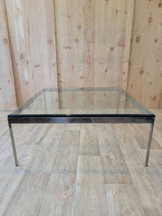 Mid Century Modern Nicos Zographos Style Glass Top Coffee Table: Vintage from the 1970s Materials: glass, metal, stainless steel Width: 42 inches Height: 17.5 inches Depth: 42 inches Description Mid Century Modern Nicos Zographos Style Stainless Steel Base Beveled