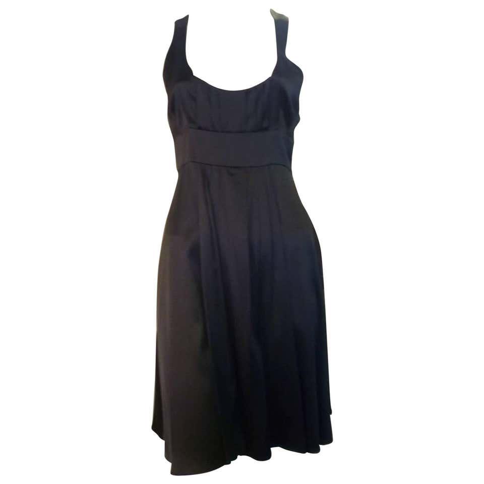 Jasmine Di Milo Black Silk Dress 10UK: This sleeveless silk dress has a racerback; scoop neck; pleating a bodiceè front and back pleated panels and a hidden zip closure at the side. There is a 5% lycra content for that little hint of