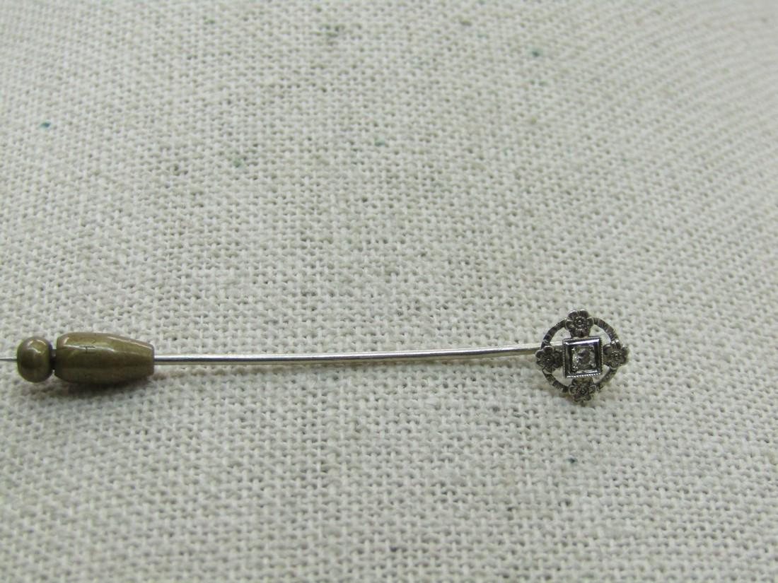 Victorian-Edwardian 18kt Diamond Floral Stick Pin, White Gold: Victorian-Edwardian 18kt Diamond Floral Stick Pin, White Gold, Late 1800's-1910. Four blossoms on the round edge with a center appx. 1.8mm diamond set in a miligrain framed square setting. The pin it 