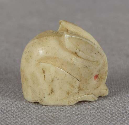 19c staghorn OJIME netsuke slide RABBIT: 19th century staghorn ojime (slide bead for tightening the cord going from netsuke to inro) carved in a shape of a crouching rabbit. Good design capturing the character of the creature, beautiful wear