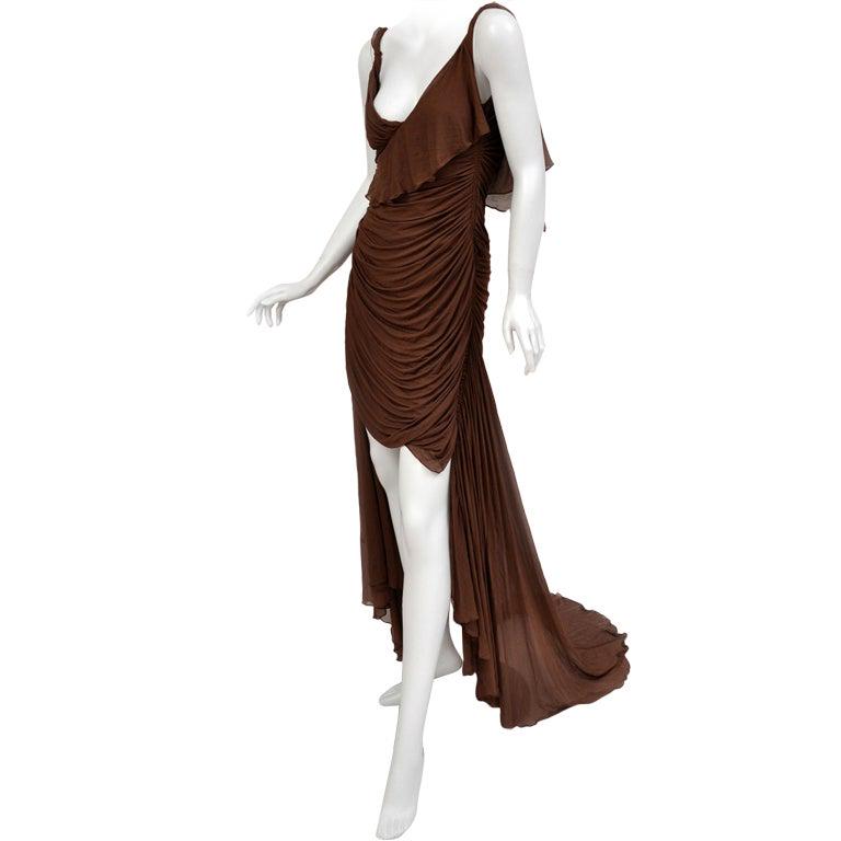 Tom Ford For Gucci Greek Goddess Silk Gown, 2003: Imbued with feminine charm is a dress crafted from Tom Ford’s imagination. Exclusively from the 2003 fall Gucci collection, it has been exhibited in the Metropolitan Museum of Art for its flawle