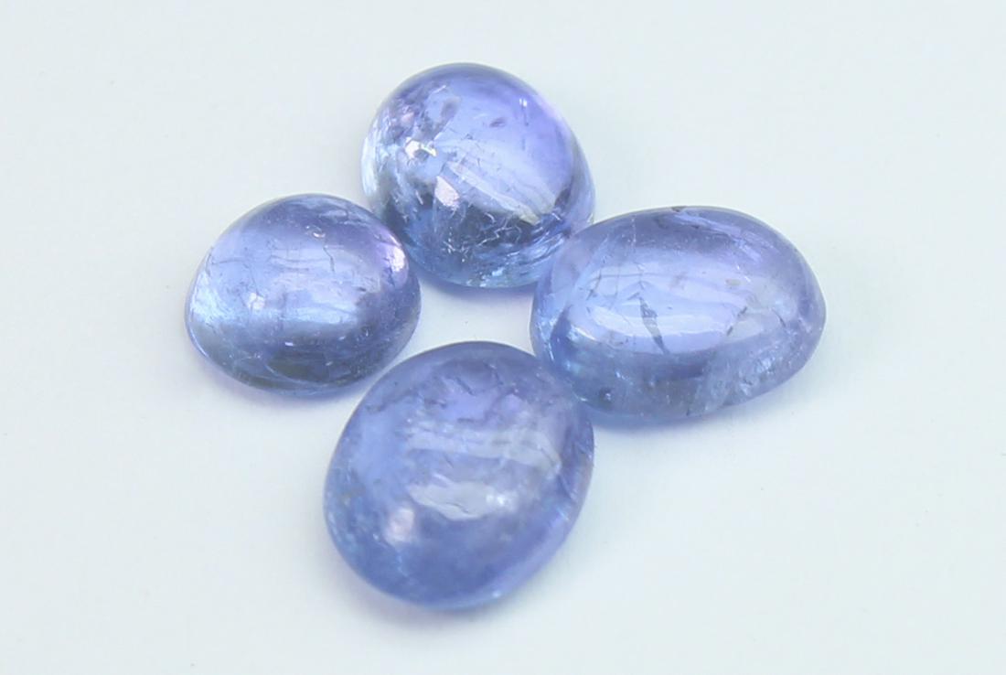 2.24 Cts Natural Tanzanite Lot: No Reserve! Gemstone : Natural Tanzanite Origin: Tanzania Weight : 2.24 carats Dimensions : 6x5 mm, 4.40-4.58x2.45 mm, (Calibrated) Shape/Cut: Oval, Round Cabochon Number of Stone : 4 Color : Violet T