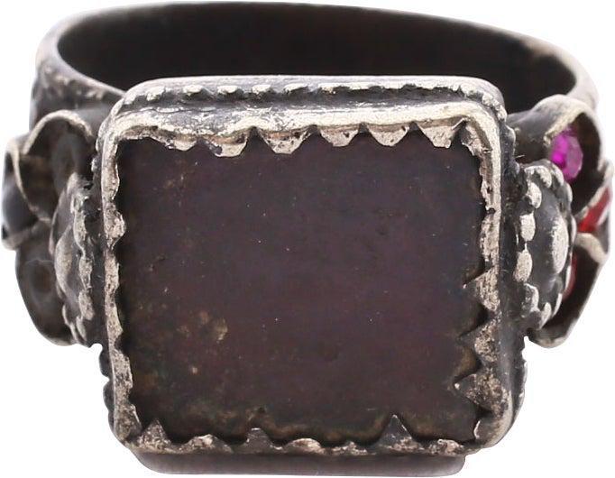 EASTERN EUROPEAN GYPSY CLAN LEADER'S RING, SIZE 8 3/4: 19th century. Size 8 3/4. White metal possibly silver. Broad 8.8mm band in five ranks with raised center flanked by bands of circles. The edges crenulated. The shoulders with trefoil mounts, one side