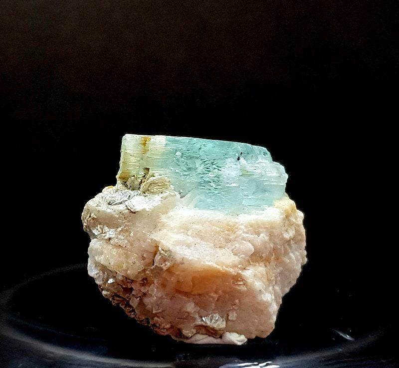 12 grams Lovely Natural damagefree Aquamarine crystal on Feldspar Specimen From shigar skardu: Description 12 grams Lovely Natural damagefree Aquamarine crystal on Feldspar Specimen From shigar skardu pakistan size 25mm 16mm 30mm weight 12 Grams Shipping and return policies Loading Estimated ar