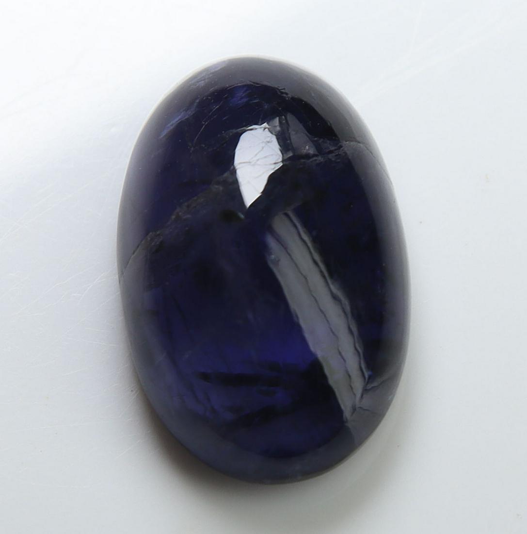 5.20 cts Natural Iolite: No Reserve! Title: 5.20 cts Natural Iolite Additional Information: Gemstone : Natural Iolite Shape and cut : Oval Cabochon Weight : 5.20 carats Measurements : 14.72x9.18x5.55 mm , Color : Violite Tran